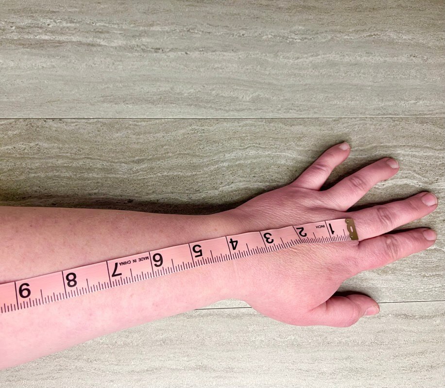 Measuring my arm for the length of my fingerless gloves. 