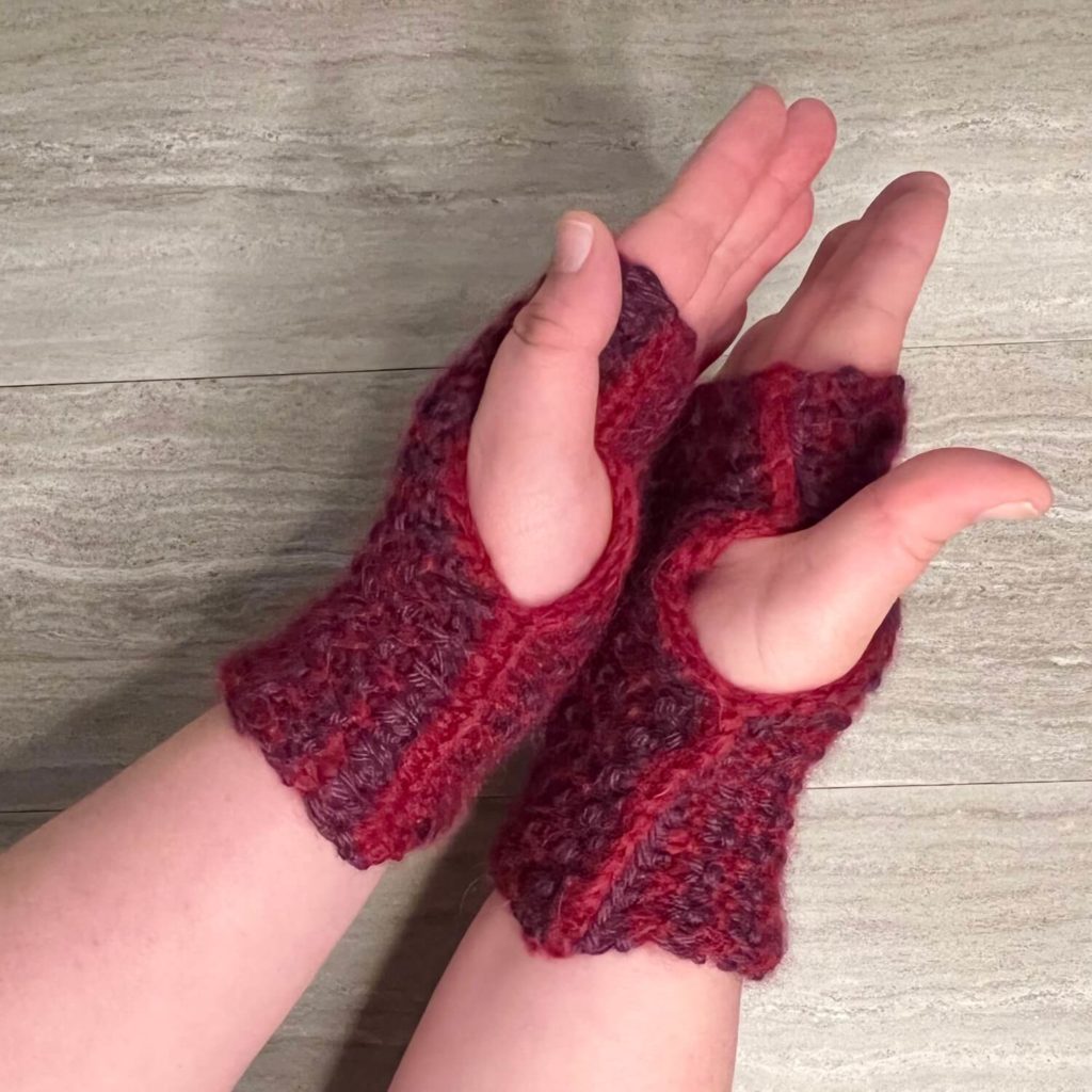 Fingerless gloves knit my way and seamed using a single crochet on the edges. 