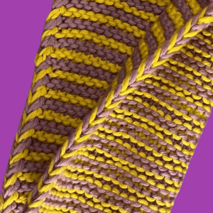 Stripe Right dishcloth pattern displaying the braided-cable edge option. Learn to knit with more than one color 